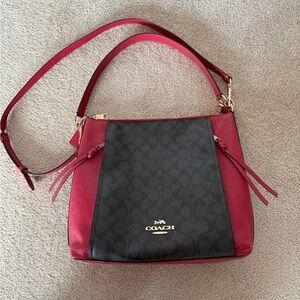 Coach Marlon Hobo Bag
In Brown Signature Canvas with Red Leather Shoulder Bag